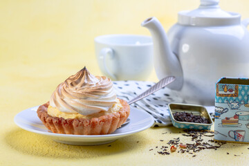 Small cheesecake with meringue on top close-up.