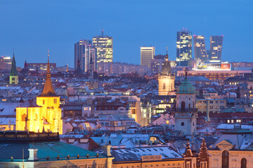 Prague - spires of the old town and office high-rises at dusk - 413870750