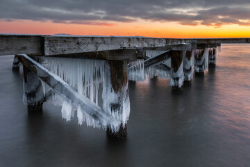 Early morning at frozen small pier in Sopot. Poland.