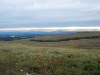 autumn steppes and hills of Khakasia, stormy sky