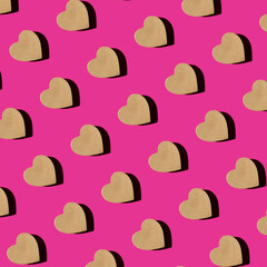 Seamless Pattern of craft gift box in the shape of heart on pink background top view Flat lay. Creative composition for Valentine`s.