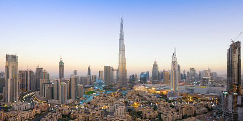Panoramic view of Dubai skyline and Burj Khalifa under golden light