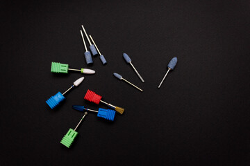 Nail tool. Cutters for hardware manicure. Accessories and nail tool on black background