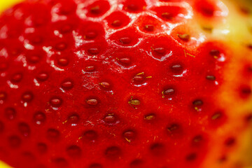 Fresh strawberry macro. background from strawberry texture