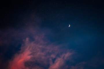 night sky with stars and moon and clouds