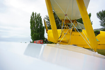 Yellow biplane with white wings