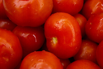 Washed red fresh tomatoes close-up