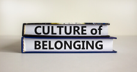 Culture of belonging symbol. Books with words 'culture of belonging' on beautiful white background. Business, culture of belonging concept. Copy space.