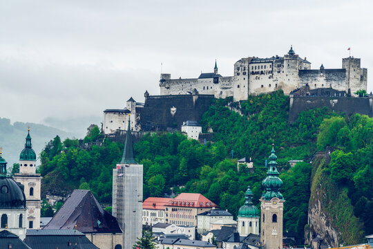 Salzburg Panorama on a gloomy and misty day. Austrian alps regio