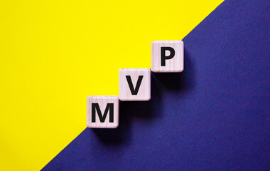 MVP, minimum viable product symbol. Wooden cubes with the word MVP, minimum viable product....