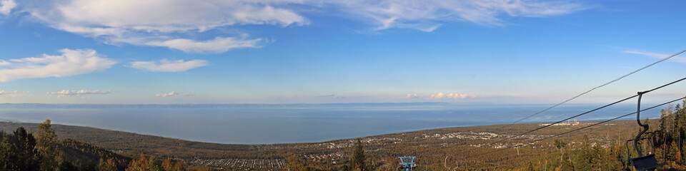 Fototapeta na wymiar View of Lake Baikal and the city of Baikalsk from the mountain