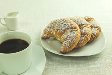 Delicious Croissants and black coffee for breakfast