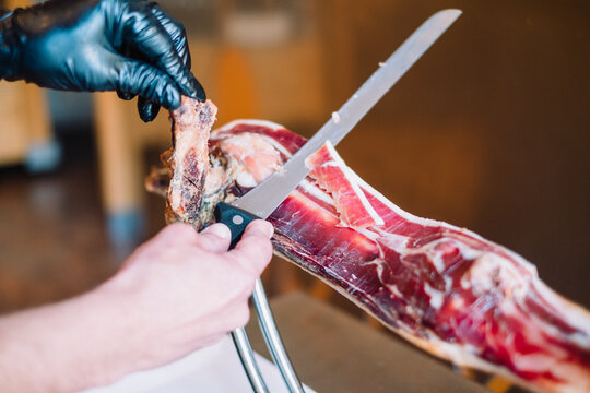 Cutting serrano ham in a restaurant