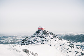 Astronomical observatory on top of a snow-capped mountain. © Luis