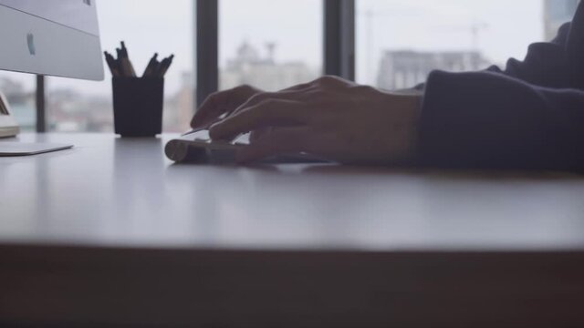 Close up. Men's hand use a computer mouse 