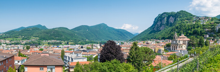 Fototapeta na wymiar Panoramic aerial view of a Swiss city. Mendrisio with to the right the church of Saints Cosmas and Damian, Switzerland
