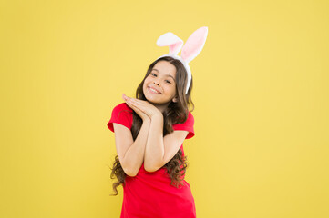 Obraz na płótnie Canvas dreaming about presents. Cheerful kid celebrate easter holiday. spring holiday tradition. girl have fun. celebrate traditional feast. Easter bunny costume. little girl in rabbit ears. happy childhood