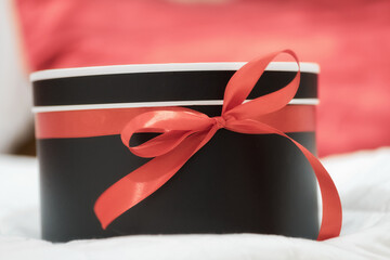 gift surprise box with red ribbon