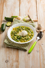 soup with poche egg green peas asparagus and zucchinis