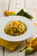 tagliatelle with zucchinis flower bacon and courgettes