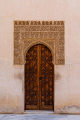 view of detailed and ornate Moorish and Arabic decoration in the arched doorways of the Nazaries Palace of the Nazaries Palace