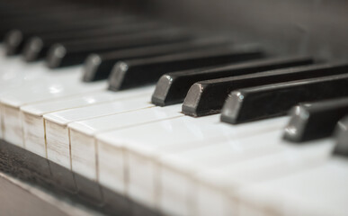 Fototapeta na wymiar black and white keys of an old vintage piano