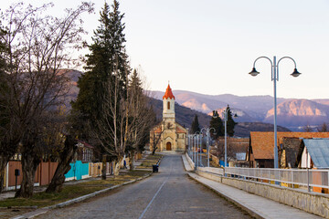 Fototapeta premium Church in Asureti, Georgia. Old famous church facade and street.