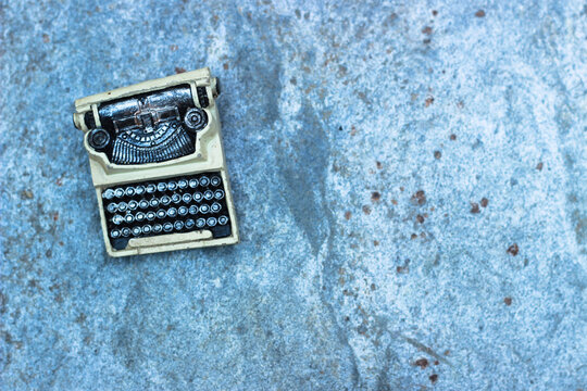 Selective focus typewriter and note papers on a wood. Concept photo for writing, storytelling, script writing or creative writing background.Copy space for yoru text. 