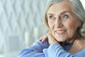 Fototapeta premium portrait of beautiful senior woman posing at home