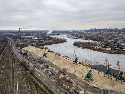 Frozen cargo port bay. Aerial drone view. Winter cloudy morning. - Powered by Adobe
