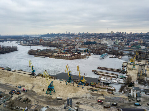 Frozen cargo port bay. Aerial drone view. Winter cloudy morning. - Powered by Adobe