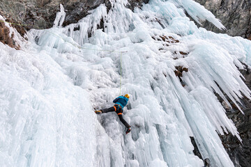 Experienced Ice climber on single pitch route, Cogne, Aosta Valley, Italy