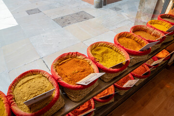 baskets of colorful spices in a shop window