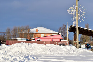 A tall pink building covered with snow.