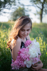 Naklejka premium Portrait of a woman. Photo of a young girl in nature.