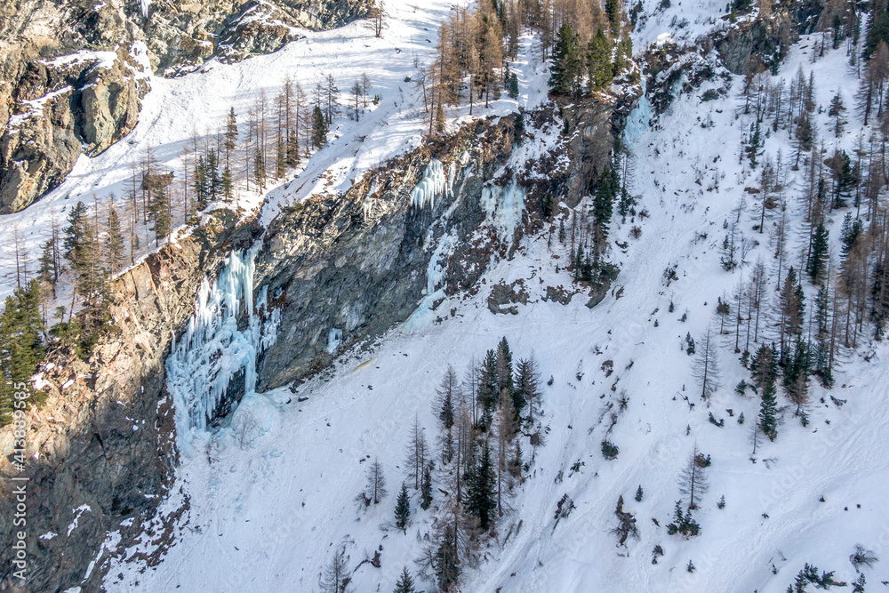 Wall mural Aerial view of frozen waterfall for ice climbing, Cogne, Aosta Valley, Italy