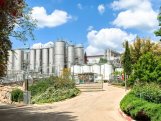 Fototapeta premium General blurred view of a modern winery with stainless steel barrels for wine fermentation