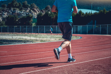 Fototapeta premium Person running on the track