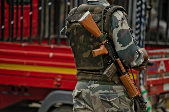 Soldier with machine gun and camouflage uniform