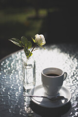 cup of coffee and rose
