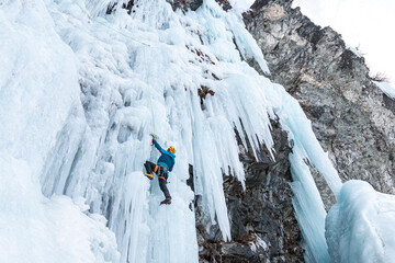Ice climbing on frozen waterfall, Cogne, Aosta Valley, Italy