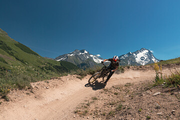 Rider in downhill mtb track in les 2 alpes, Ecrins, Oisans, France