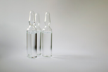 Medical ampoules for injection isolated on white background. Medicines and disease treatment,...