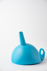 View of blue funnel on white background in vertical, with copy space