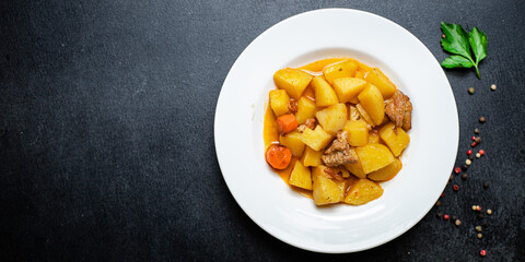 potatoe stewed goulash and meat roast second course vegetables portion on the table healthy meal snack outdoor top view copy space for text food background rustic image