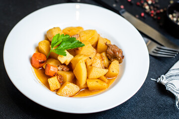 potatoe stewed goulash and meat roast second course vegetables portion on the table healthy meal snack outdoor top view copy space for text food background rustic image