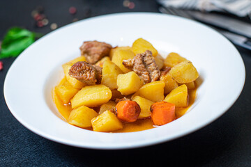 potatoe stewed goulash and meat roast second course vegetables portion on the table healthy meal snack outdoor top view copy space for text food background rustic image