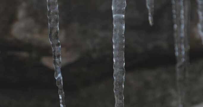 Icicles hanging off of a rock, winter landscape at lessinia park