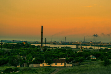 SunsetSunset. Summer. Industrial city. Lake. The hills. Mountains. Beautiful background. Desktop background. A provincial town. Temirtau. Kazakhstan. Nature. Metallurgical plant.