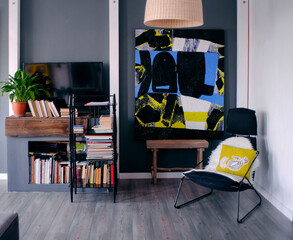 Interior of modern home with books and painting